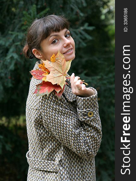 Beautiful woman walking in the autumn park. Beautiful woman walking in the autumn park