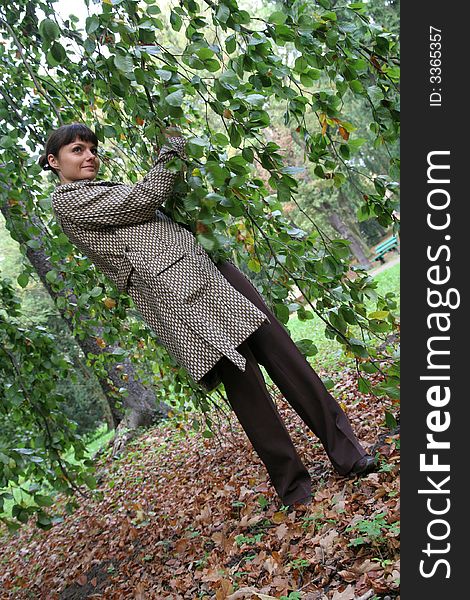 Beautiful woman walking in the autumn park. Beautiful woman walking in the autumn park