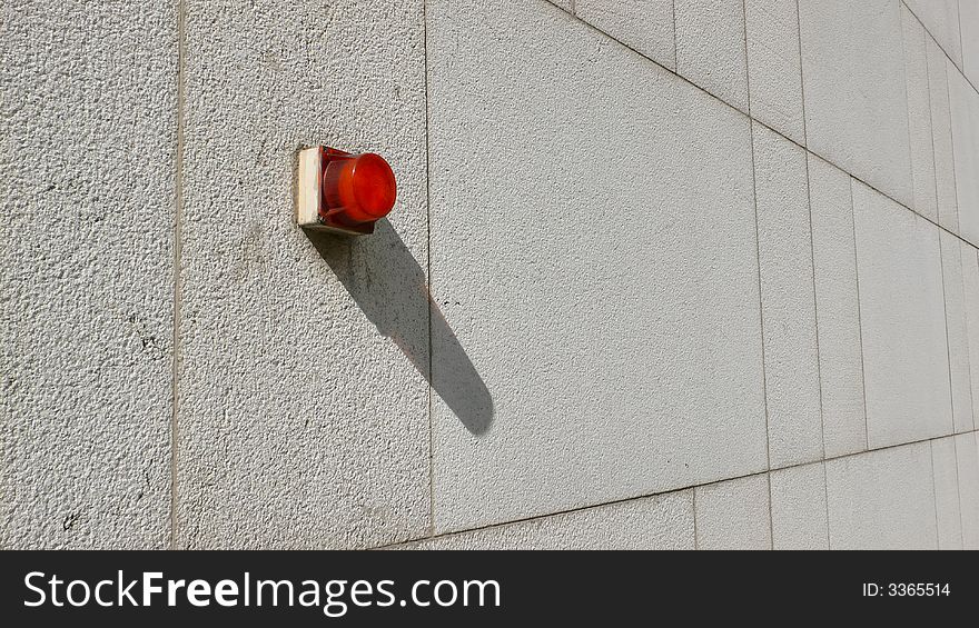 Alarm light on a concrete wall. Alarm light on a concrete wall