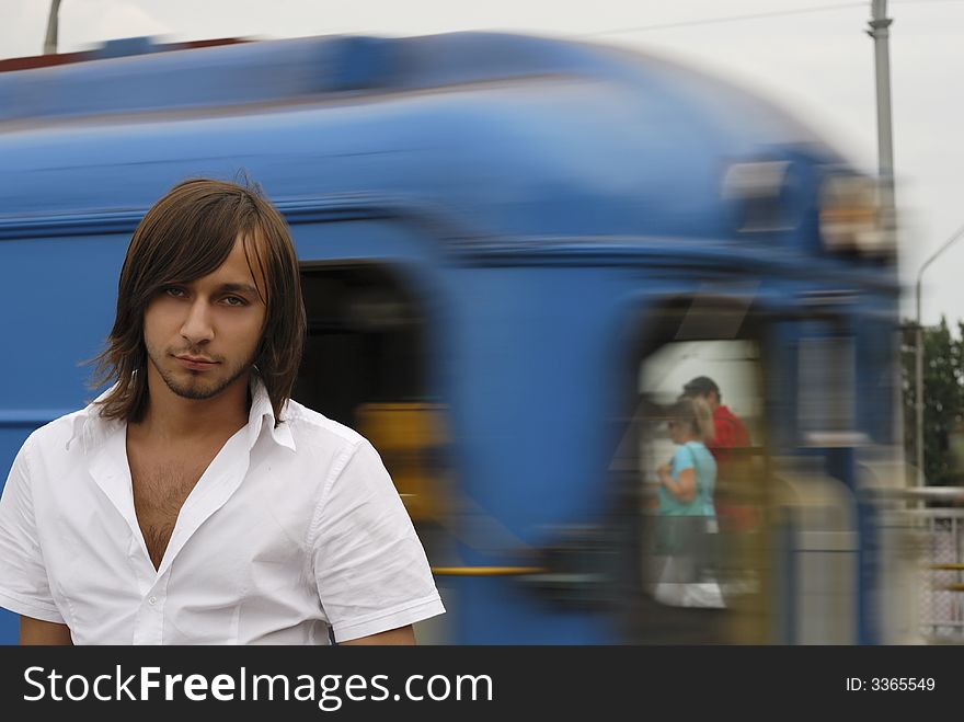 Man in a metro station with blured by motion train on the background. Man in a metro station with blured by motion train on the background