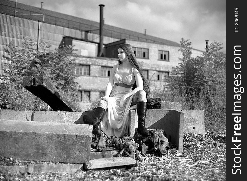 Long haired girl sitting in a old industrial zone. Pentax 6x7, Ilford SFX, Deep red filter.