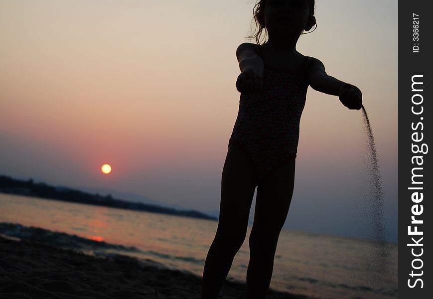 Young Kid Girl Pouring Sand