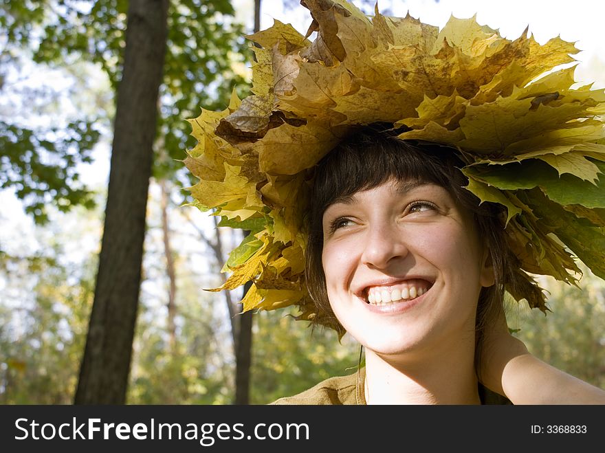Beautiful girl with wreath of leaves. Beautiful girl with wreath of leaves
