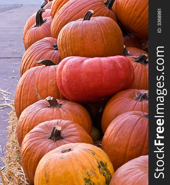 Large orange pumpkins on the haystack