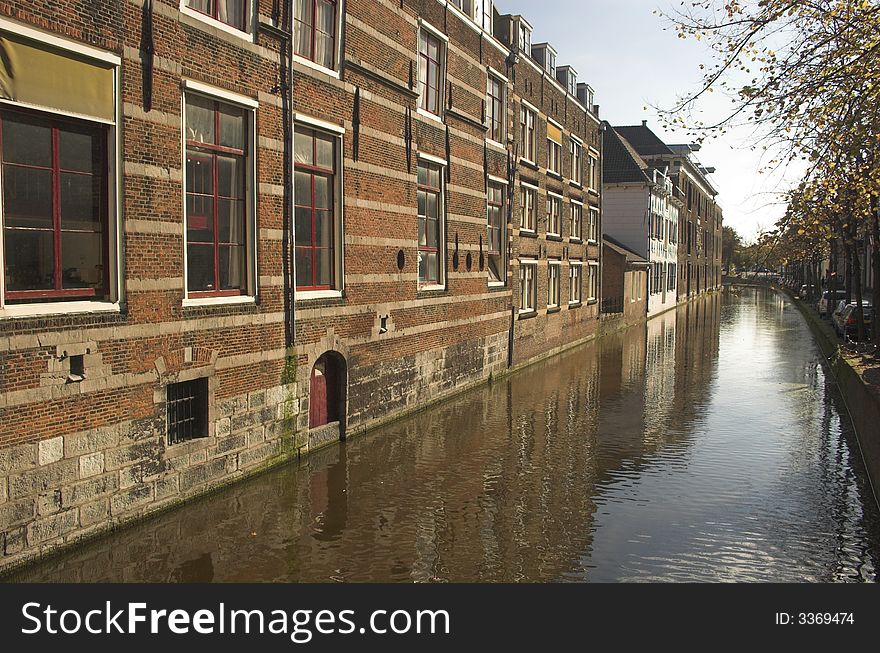 Streets of Delft, a small town in Holland, the area of the city centre and neighbouring streets with row houses made of red bricks, built over a century ago.