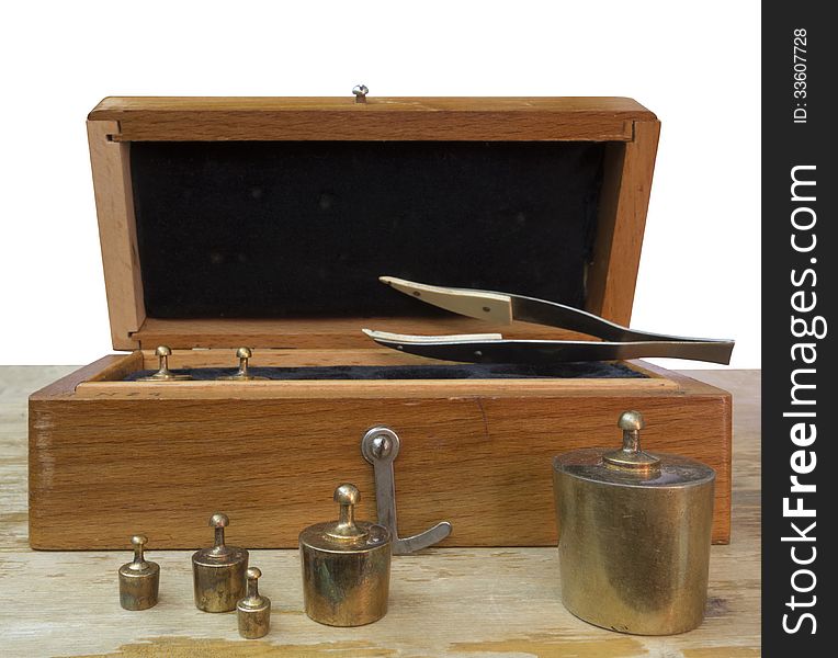 Set of small weights for weighing in a wooden box