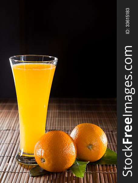 Orange juice on black background