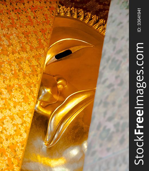 Eye of the golden lying buddha in Wat Pho, bangkok thailand. Eye of the golden lying buddha in Wat Pho, bangkok thailand