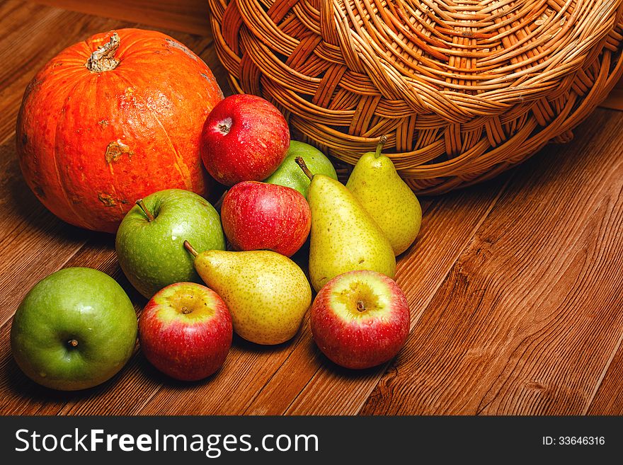 Harvest of ripe fruits and vegetables: apples, pears and pumpkin. Harvest of ripe fruits and vegetables: apples, pears and pumpkin