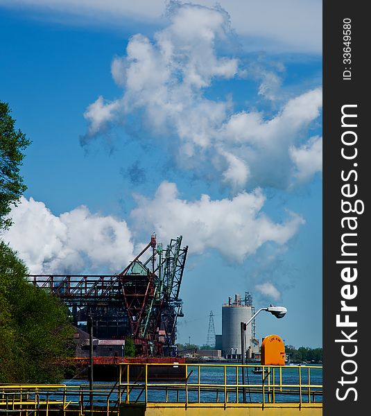 Steel mill boat dock cranes on Detroit river. Steel mill boat dock cranes on Detroit river