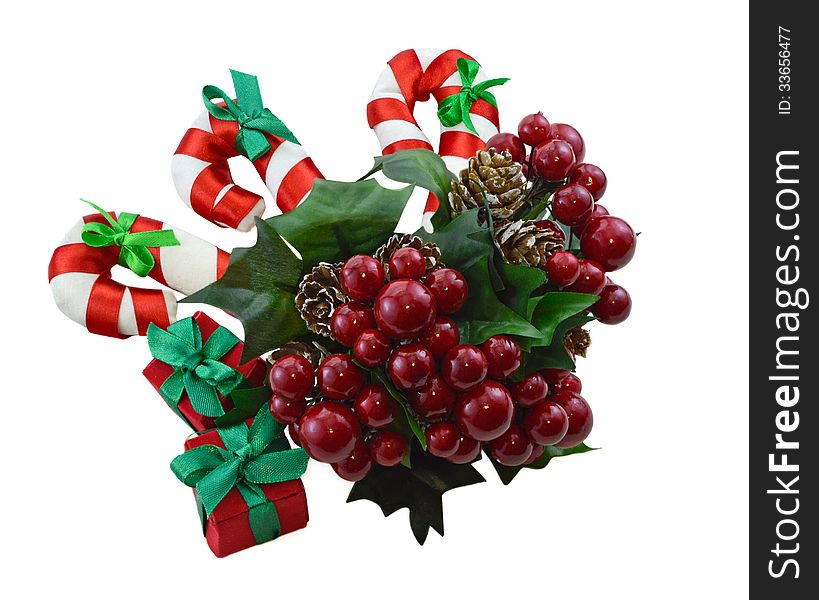 Christmas decoration with bunch of berries, canes and gift boxes isolated