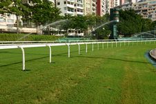 Horse Racing Track With Sprinkler Stock Photos Horse Racing Track With Sprinkler Stock Photos