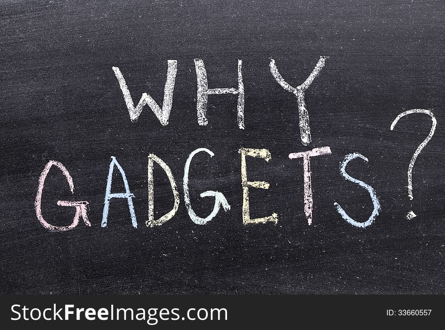 Why gadgets question handwritten on school blackboard