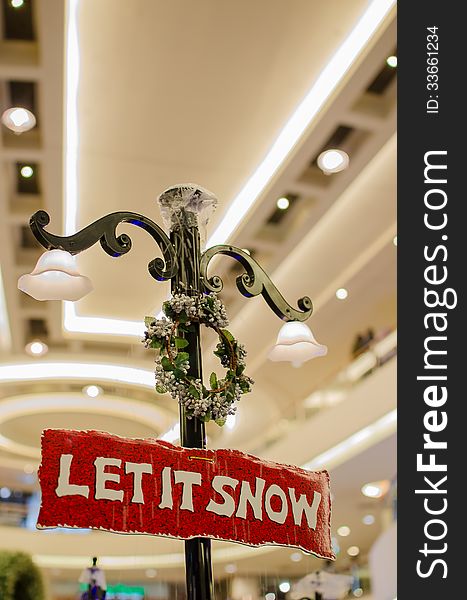 Christmas Signboard Let it snow with blurred background