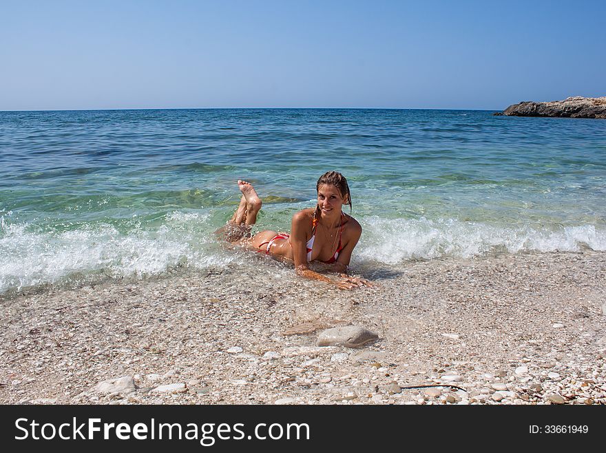 Beautiful young woman enjoying the sea. Beautiful young woman enjoying the sea