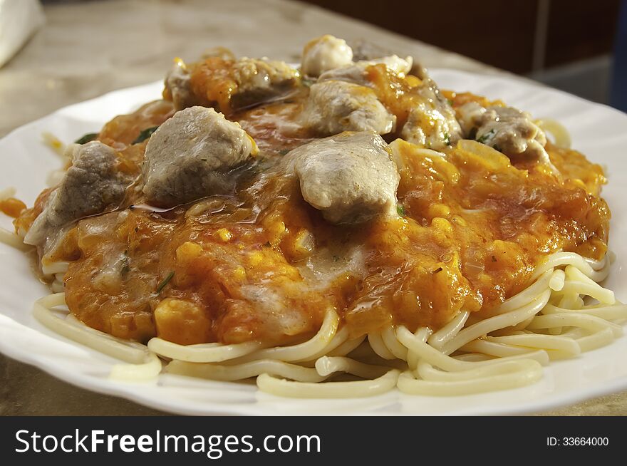 In Italian spaghetti with meat sauce