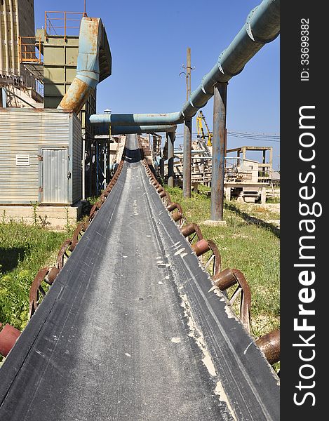 Belt conveyor transporting chalk taken from chalk stone pit to Danube shore, to be loaded into barges.