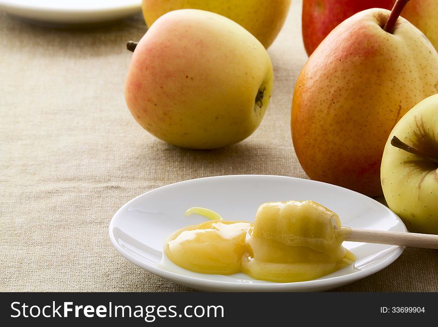 Ripe apples and pears and honey on a saucer. Ripe apples and pears and honey on a saucer