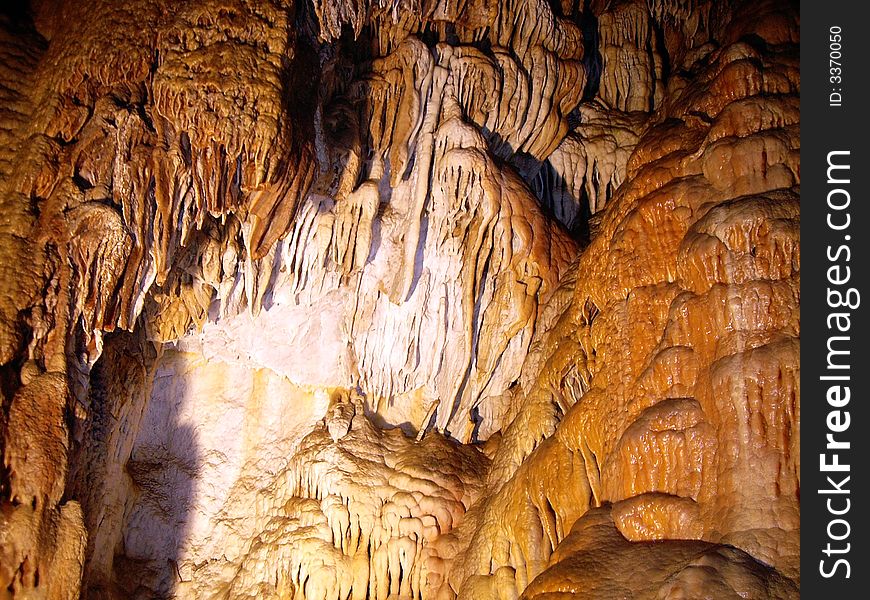 Stalactite and stalagmite in large grotto