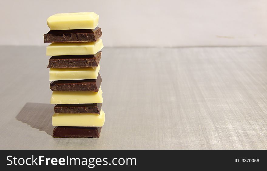 Pieces of white and dark chocolate