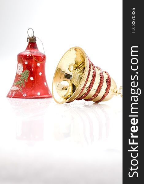 Christmas tree decoration bell on white background. Golden one.