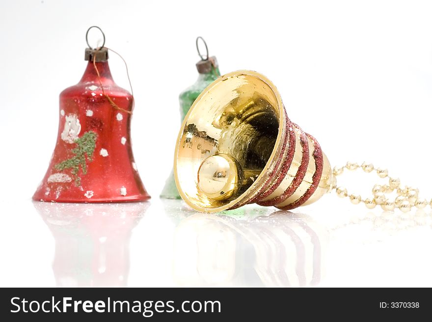 Christmas tree decoration bell on white background. Golden one.