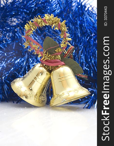 Blue Christmas tree decoration with golden bells.