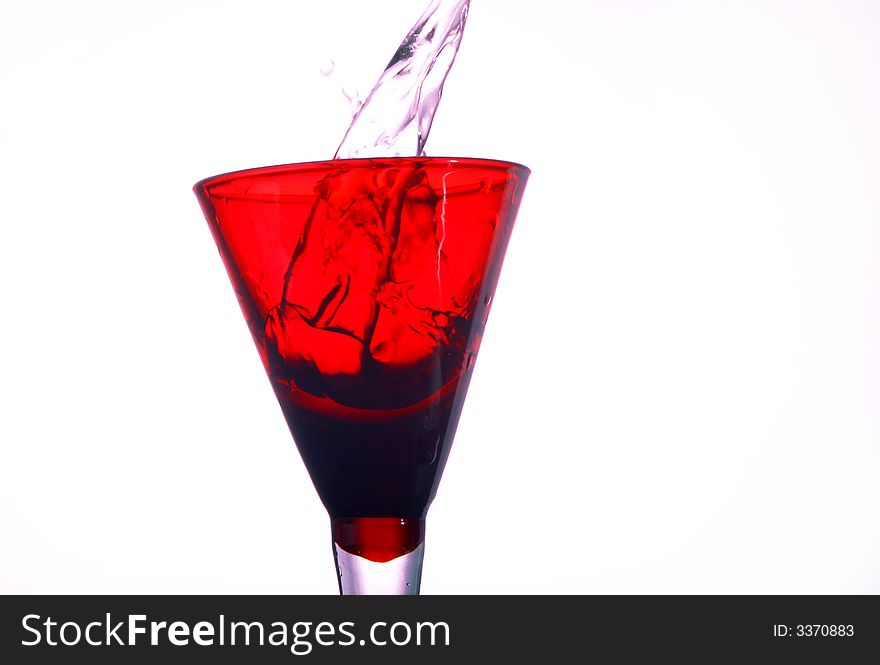 A red glass full of water