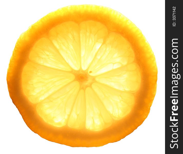 Slice of yellow lemon with background light.