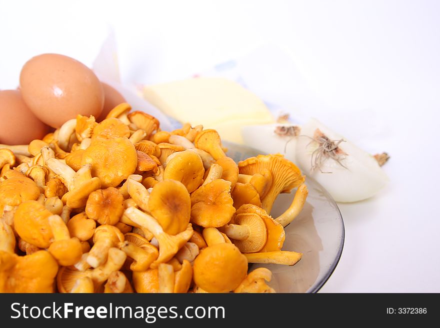 Chanterelle on plate and eggs