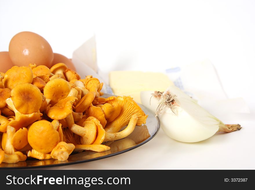 Chanterelle on plate and eggs