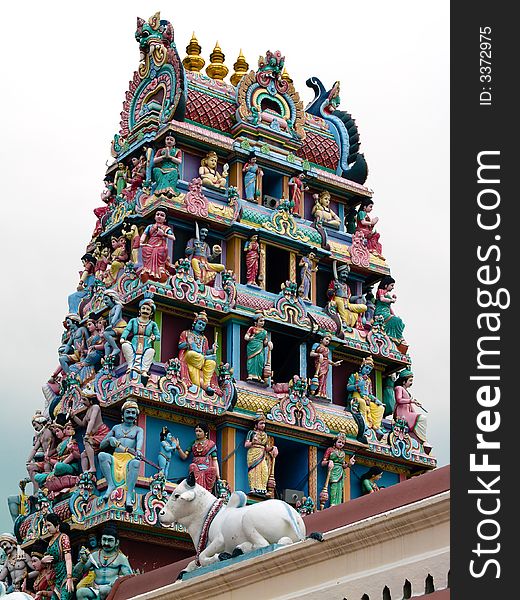 Steeple of Hindu Temple adorned with various figurines depicting tales from the Ramayana and other sacred text. Steeple of Hindu Temple adorned with various figurines depicting tales from the Ramayana and other sacred text.