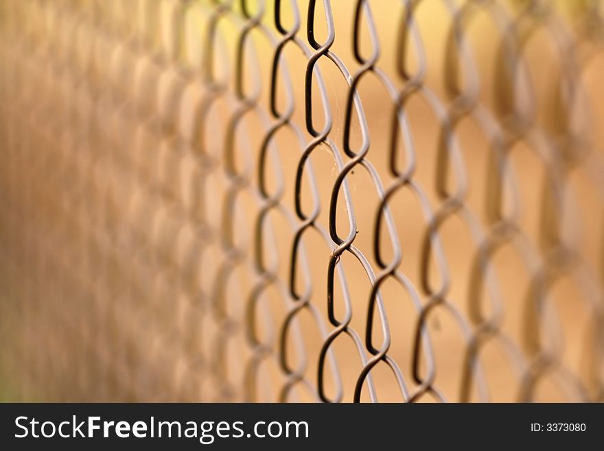 Wire netting on brown background - depth of field. Wire netting on brown background - depth of field