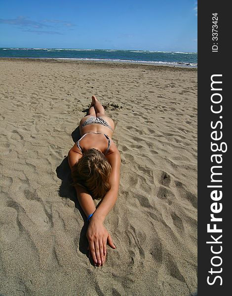 Young model at white sandy beach. Young model at white sandy beach