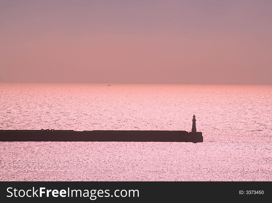 Lighthouse in Dover Harbor at sunrise. Lighthouse in Dover Harbor at sunrise