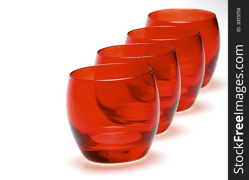 A group of red cocktail glasses.