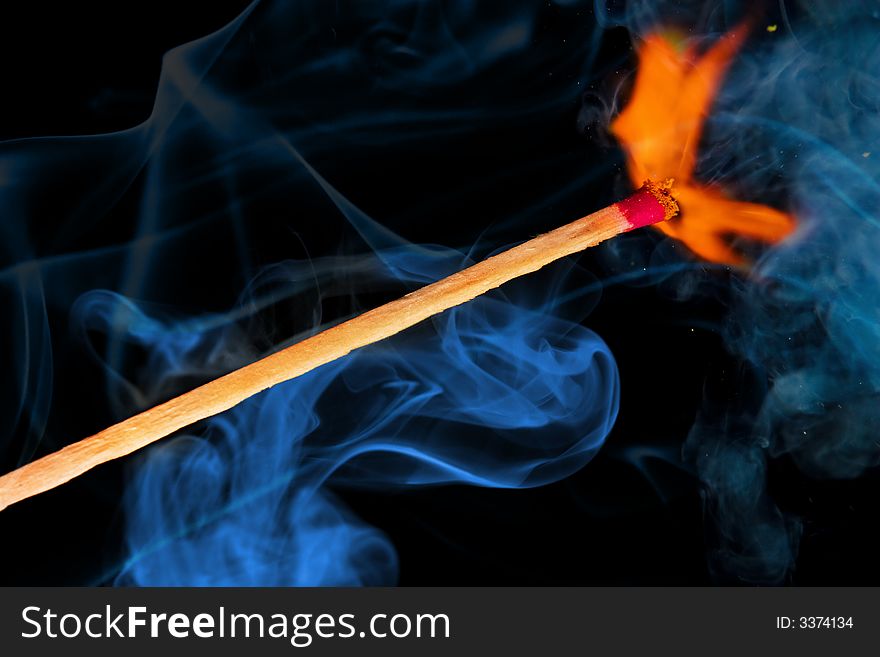 Burning match and color smoke