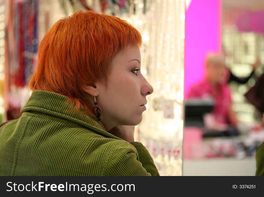 Red-haired woman in Accessories shop