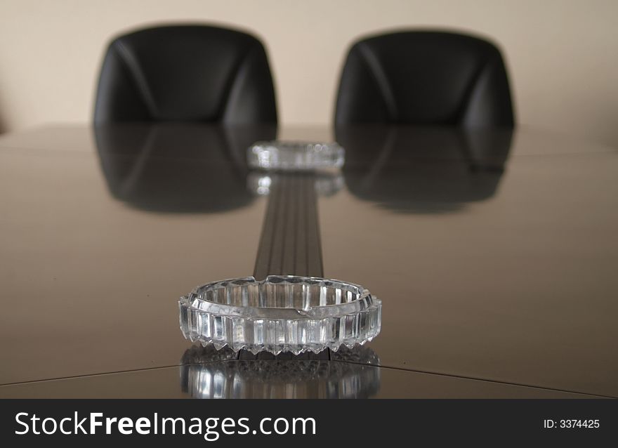 In the meeting room,a ashtray is on the table. In the meeting room,a ashtray is on the table.