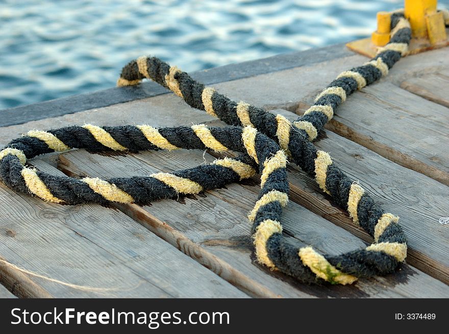 Wet boater's rope on dock