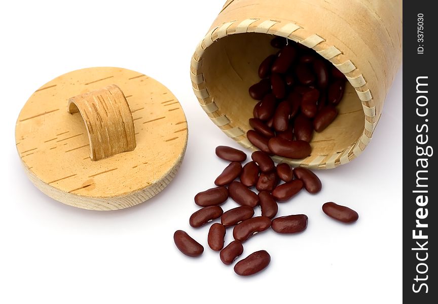 Kidney beans spilling out over a white background