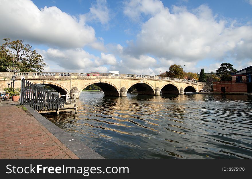 Early Autumn by the River Thames in England with Henley Road Bridge in the background. Early Autumn by the River Thames in England with Henley Road Bridge in the background