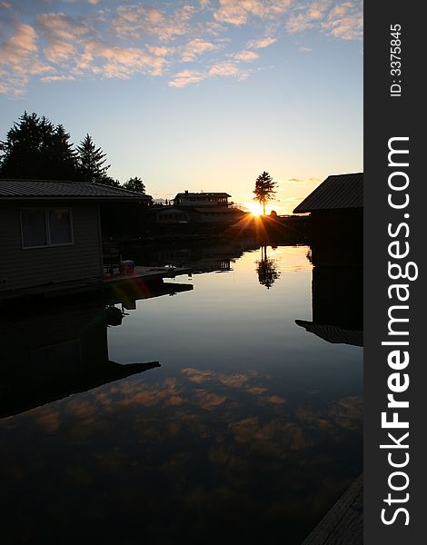Sunset at a harbor with floathouses in the village of Wrangell, Alaska. Sunset at a harbor with floathouses in the village of Wrangell, Alaska