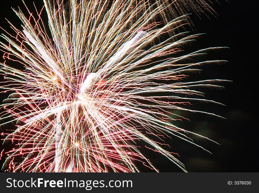 Bright white light of fireworks exploding against the night sky on the 4th of July. Bright white light of fireworks exploding against the night sky on the 4th of July