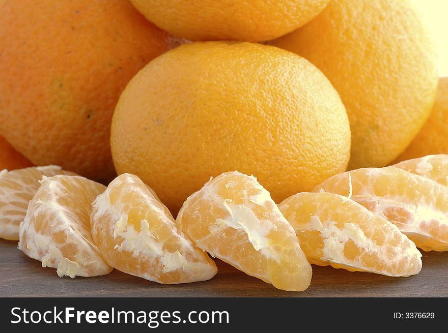 A juicy tangerine partially peeled