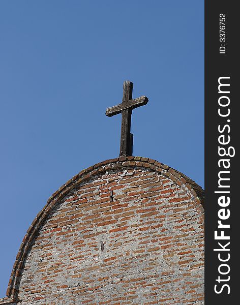 Wooden Cross On Building