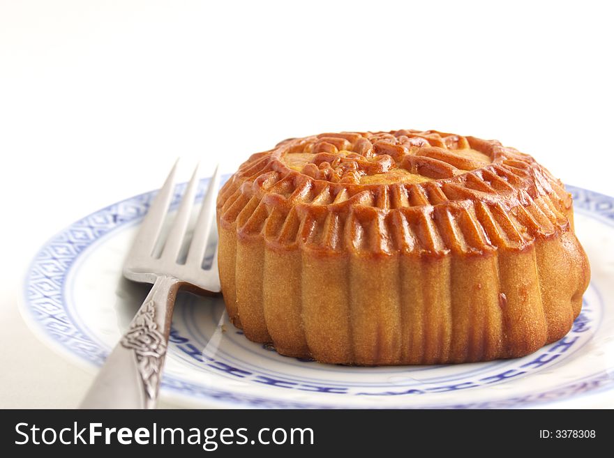 Close up of a delicious mooncake on white background.