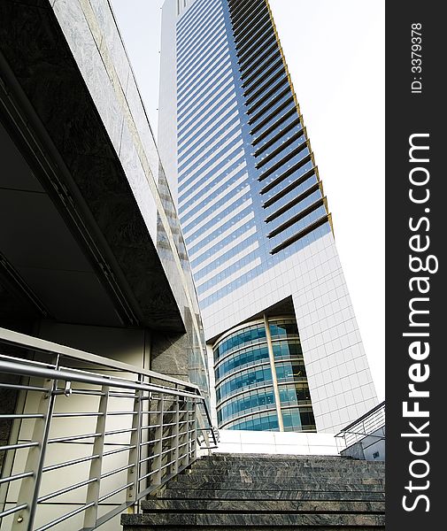 Stairway leading up to a modern office building in busy metropolis. Stairway leading up to a modern office building in busy metropolis