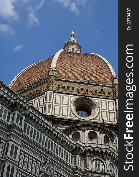 A close up view of the top spire of the duomo in Florence Italy. A close up view of the top spire of the duomo in Florence Italy