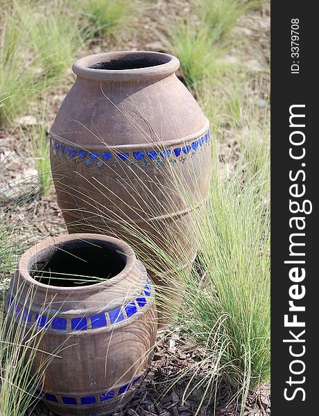 Pair of arabic pots in a garden in Dubai. Pair of arabic pots in a garden in Dubai.